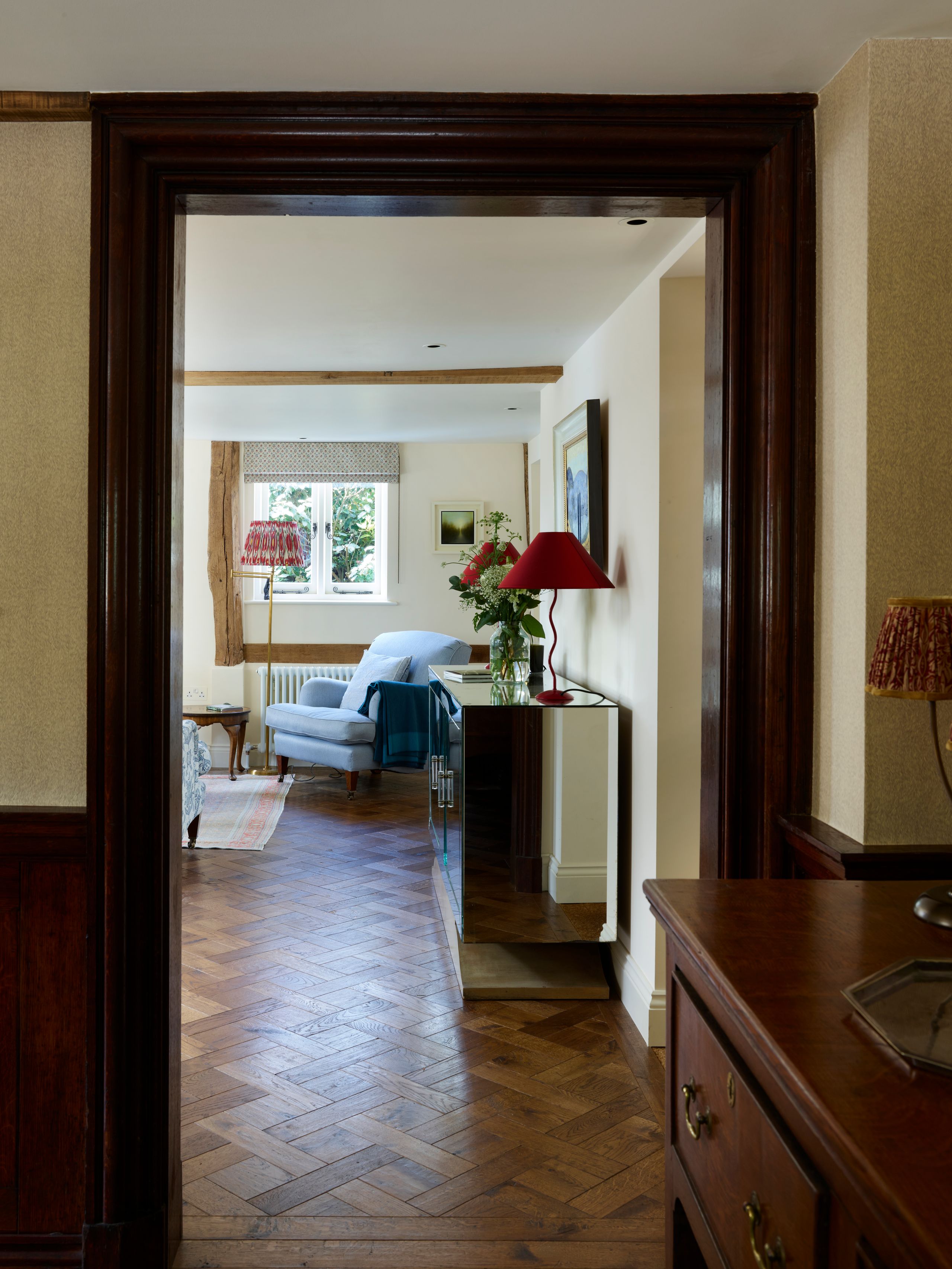 Image may contain: Floor, Flooring, Indoors, Interior Design, Lamp, Wood, Hardwood, Art, Painting, Chair, and Furniture