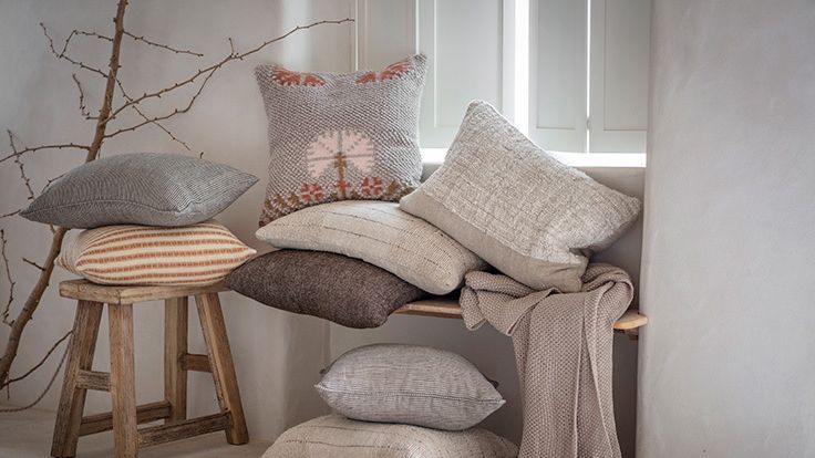 Image may contain: Cushion, Home Decor, Pillow, Linen, Furniture, and Rug