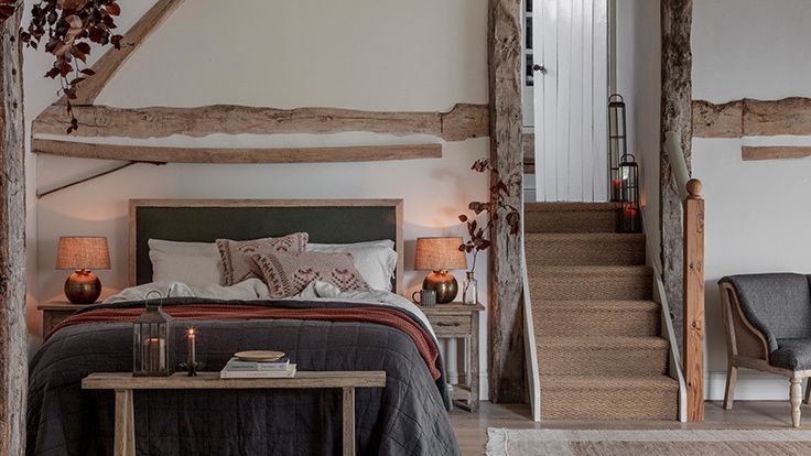 Image may contain: Lamp, Indoors, Furniture, Chair, Bed, Bedroom, Room, Interior Design, Home Decor, Rug, Cup, and Plate