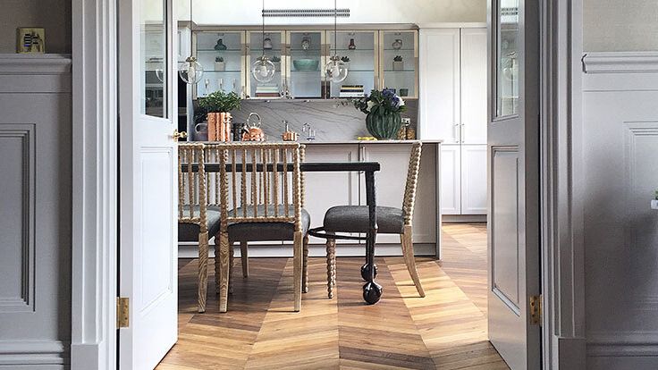 Image may contain: Floor, Flooring, Indoors, Interior Design, Wood, Hardwood, Chair, Furniture, Plant, and Dining Table