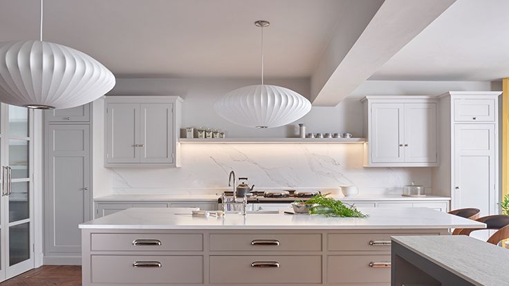 Image may contain: Indoors, Kitchen, Interior Design, Lamp, Sink, Sink Faucet, and Kitchen Island