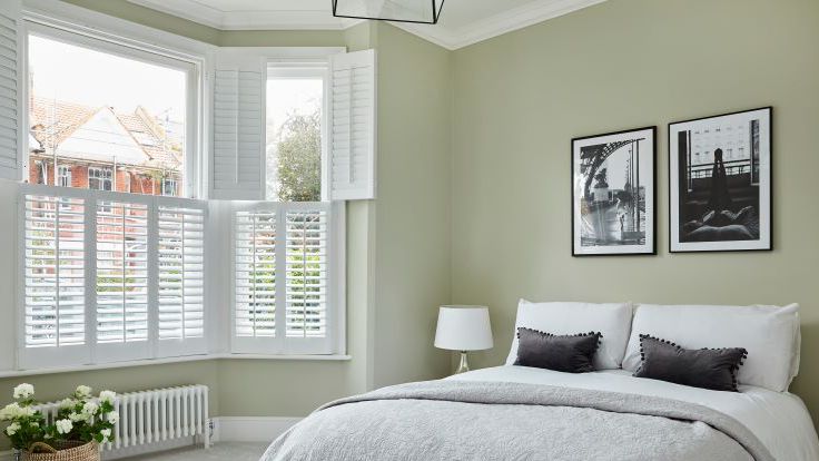 Image may contain: Lamp, Window, Bed, Furniture, Home Decor, Photo Frame, and Bay Window