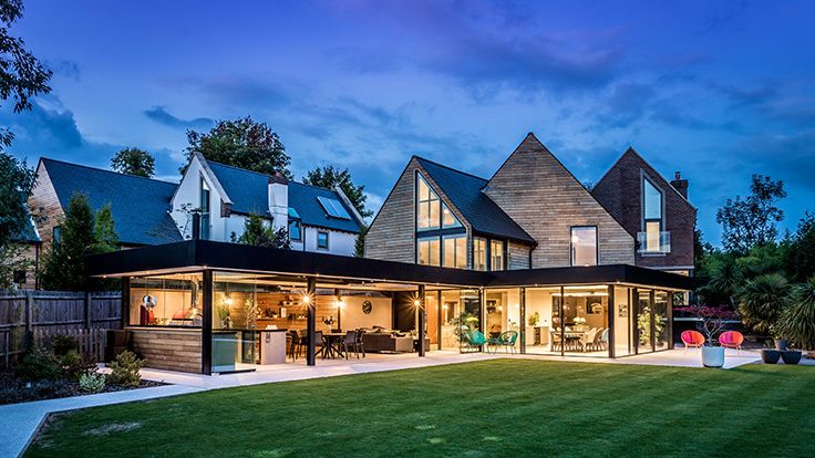 Image may contain: Grass, Plant, Suburb, Lawn, Architecture, Building, Housing, Chair, Furniture, and Outdoors