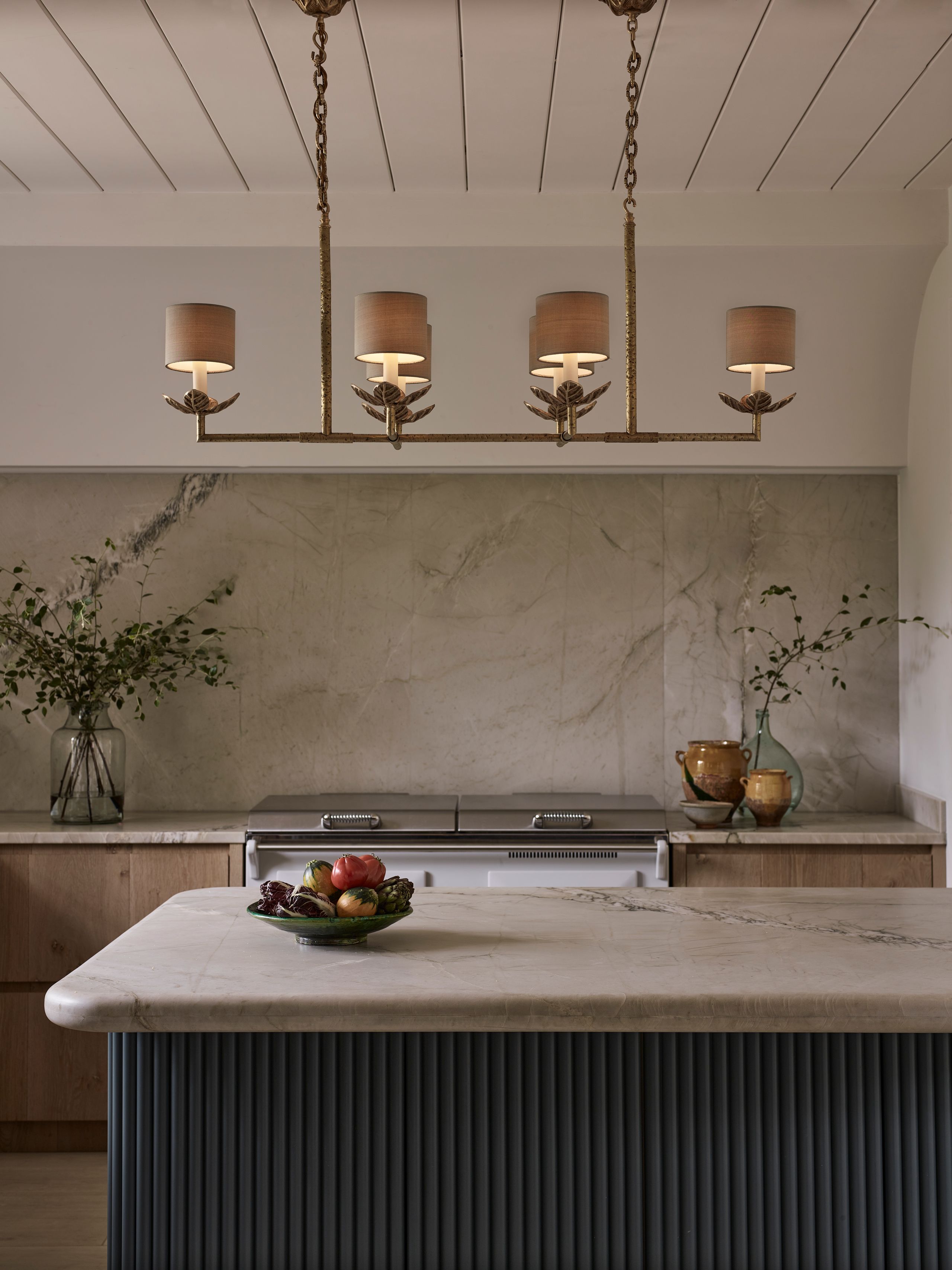 Image may contain: Indoors, Interior Design, Kitchen, Flower, Flower Arrangement, Plant, and Kitchen Island