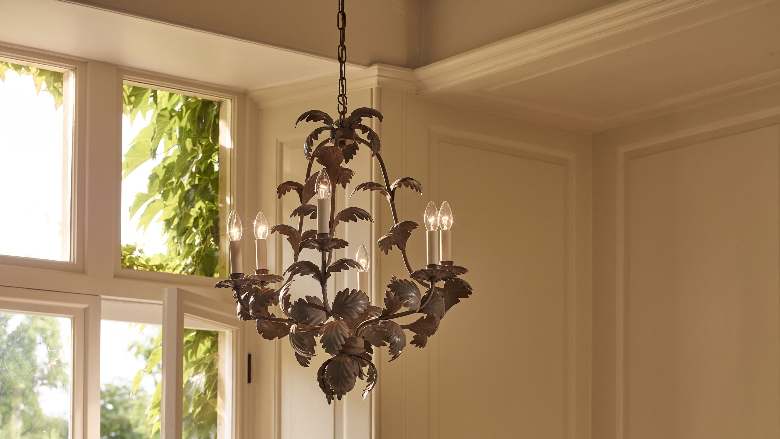 Image may contain: Chandelier, Lamp, Door, Indoors, Interior Design, Architecture, Building, and Housing