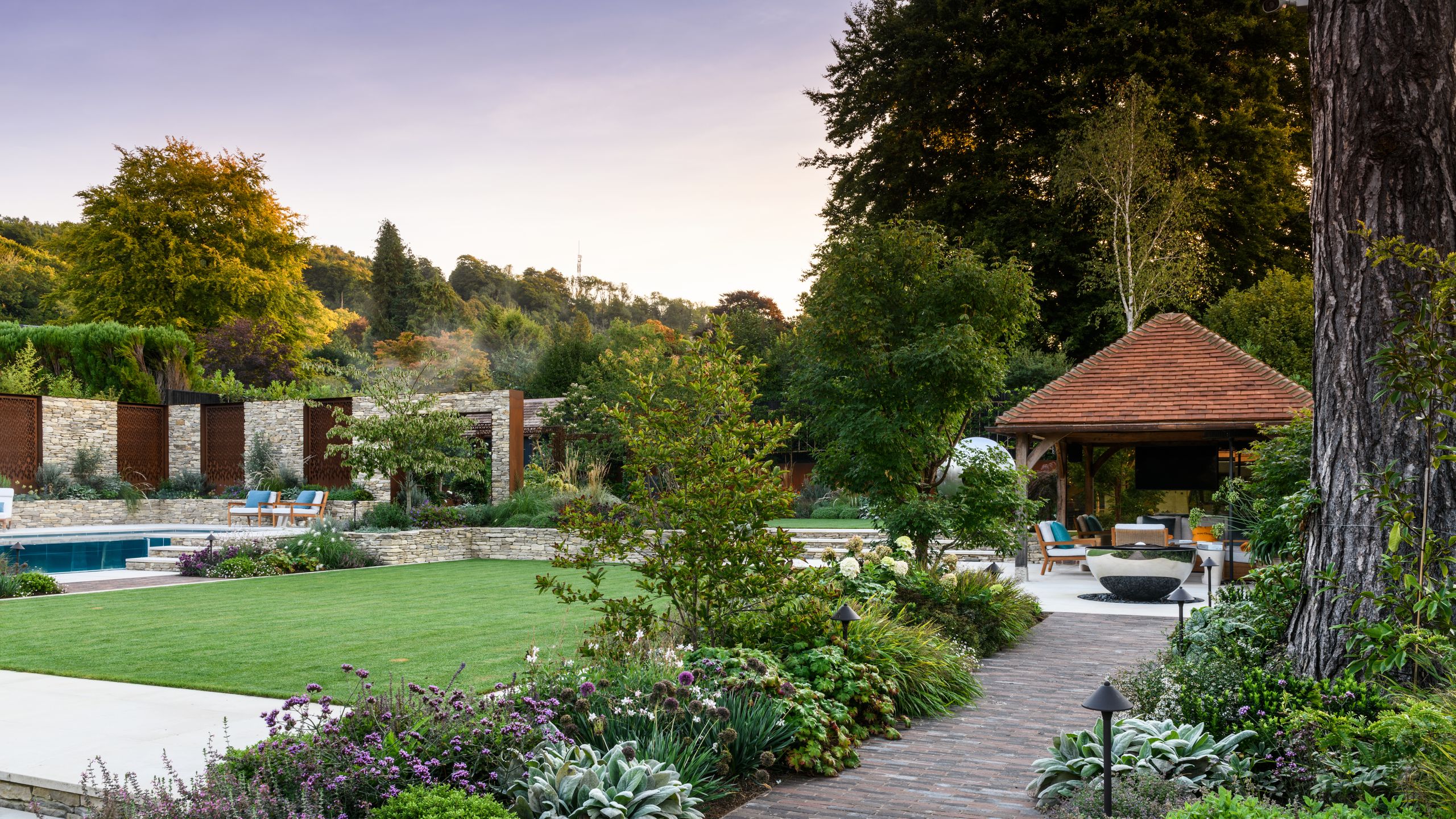 Image may contain: Backyard, Nature, Outdoors, Yard, Grass, Plant, Architecture, Building, House, Housing, Villa, and Garden