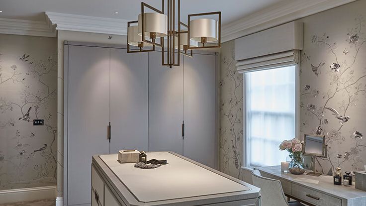 Image may contain: Lamp, Corner, Chandelier, Chair, Furniture, Sink, Sink Faucet, Indoors, Interior Design, Desk, and Table