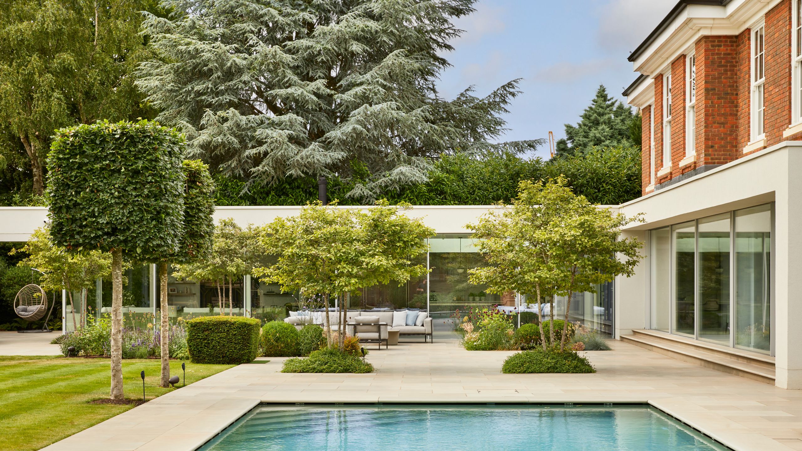 Image may contain: Architecture, Building, House, Housing, Villa, Backyard, Nature, Outdoors, Yard, Pool, Water, and Grass