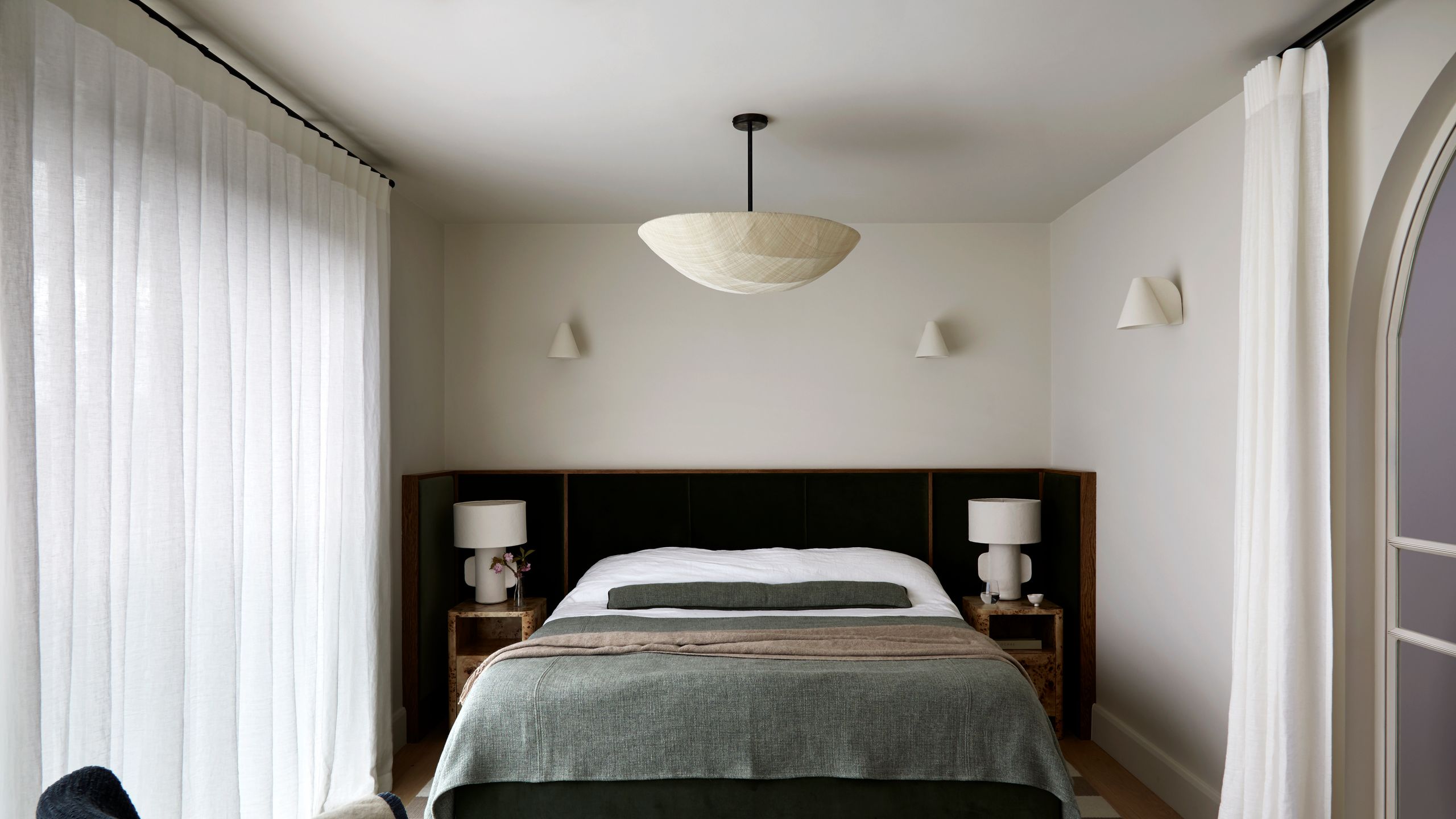 Image may contain: Lamp, Home Decor, Indoors, Interior Design, Bed, Furniture, Chair, Bedroom, Room, and Corner