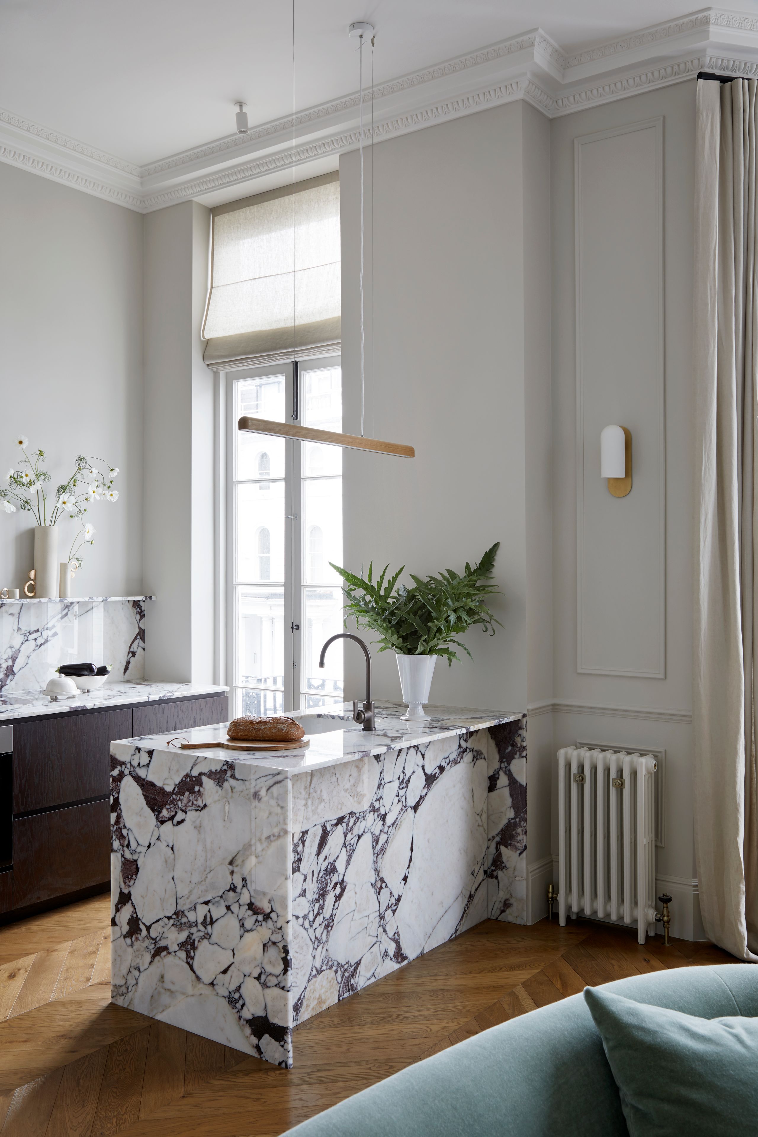 Image may contain: Indoors, Interior Design, Plant, Sink, Sink Faucet, Couch, Furniture, Bread, Food, Home Decor, and Kitchen