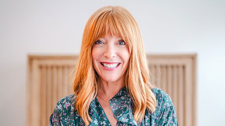 Image may contain: Blonde, Hair, Person, Face, Happy, Head, Smile, Photography, Portrait, Adult, Blouse, and Clothing