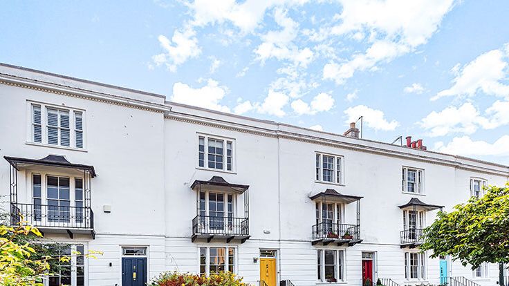 Image may contain: Architecture, Building, Housing, City, House, Person, Plant, Urban, and Row House