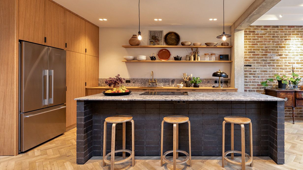 Image may contain: Indoors, Interior Design, Kitchen, Kitchen Island, Bar Stool, Furniture, Appliance, and Device