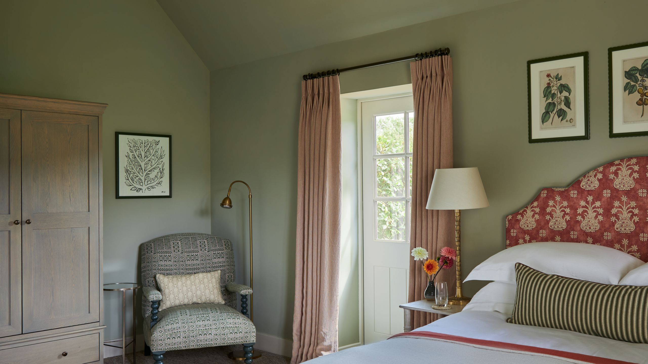 Image may contain: Corner, Chair, Furniture, Lamp, Bed, Home Decor, Art, Painting, Door, Cushion, Cup, and Table Lamp