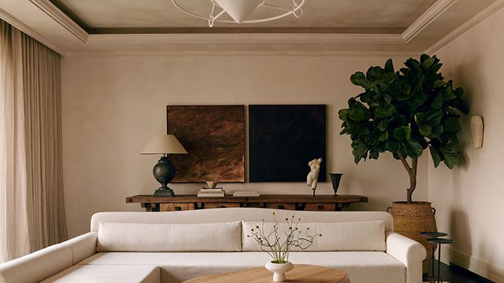 Image may contain: Lamp, Furniture, Table, Home Decor, Plant, Indoors, Interior Design, Architecture, and Building