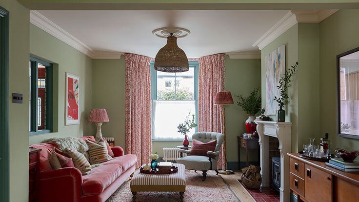 Image may contain: Home Decor, Lamp, Couch, Furniture, Rug, Plant, Architecture, Building, Indoors, Living Room, and Room