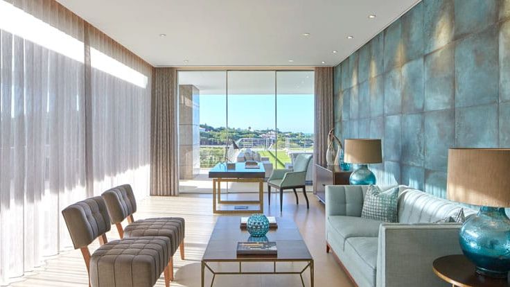 Image may contain: Book, Publication, Lamp, Couch, Furniture, Home Decor, Chair, Desk, Table, Indoors, and Interior Design