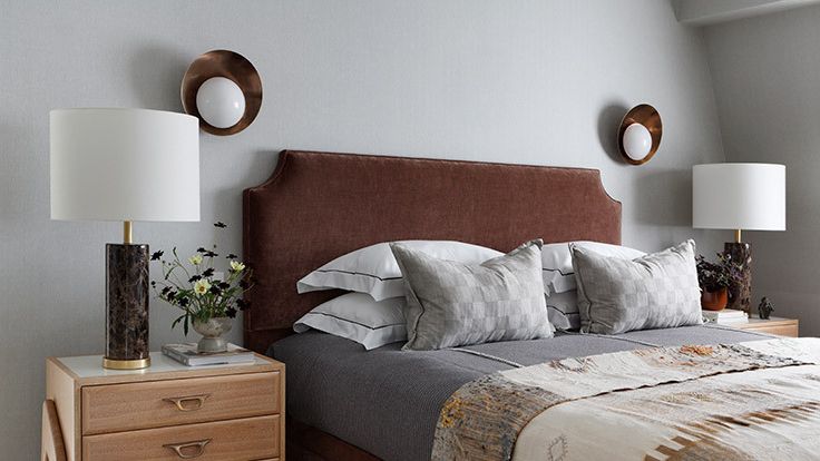 Image may contain: Lamp, Book, Publication, Table Lamp, Home Decor, Plant, Bed, Furniture, Cushion, and Indoors