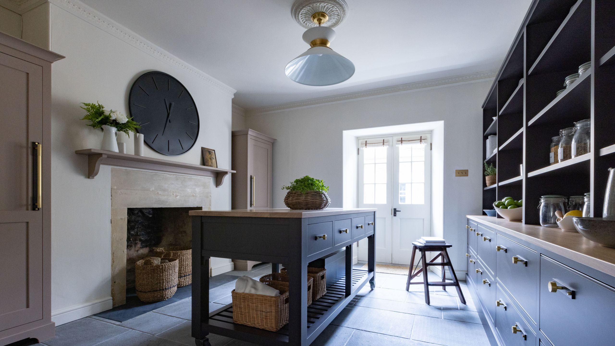 Image may contain: Corner, Plant, Floor, Indoors, Interior Design, Kitchen, Furniture, Table, Desk, Home Decor, and Art