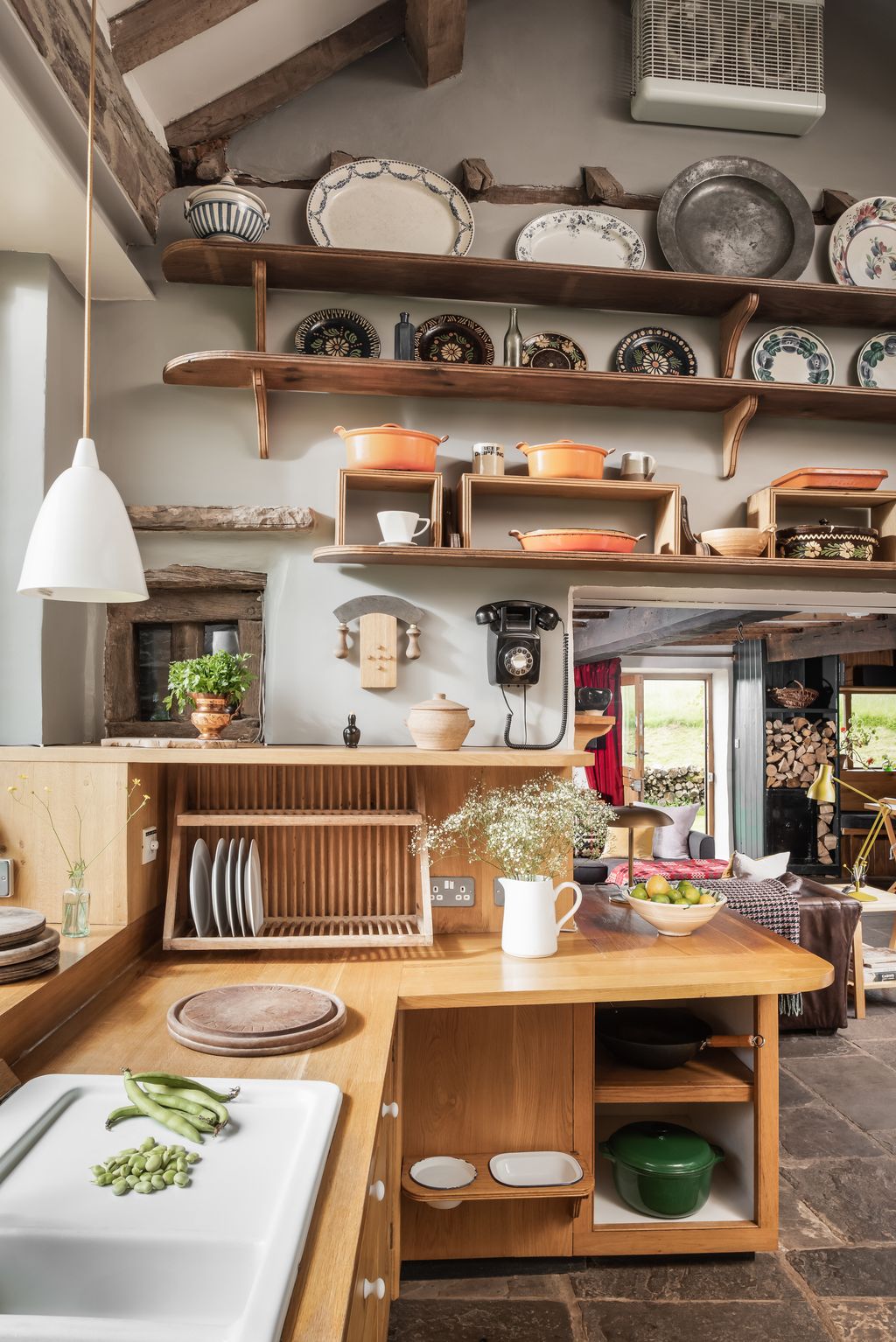 Image may contain Indoors Interior Design Plant Architecture Building Dining Room Dining Table Furniture and Room