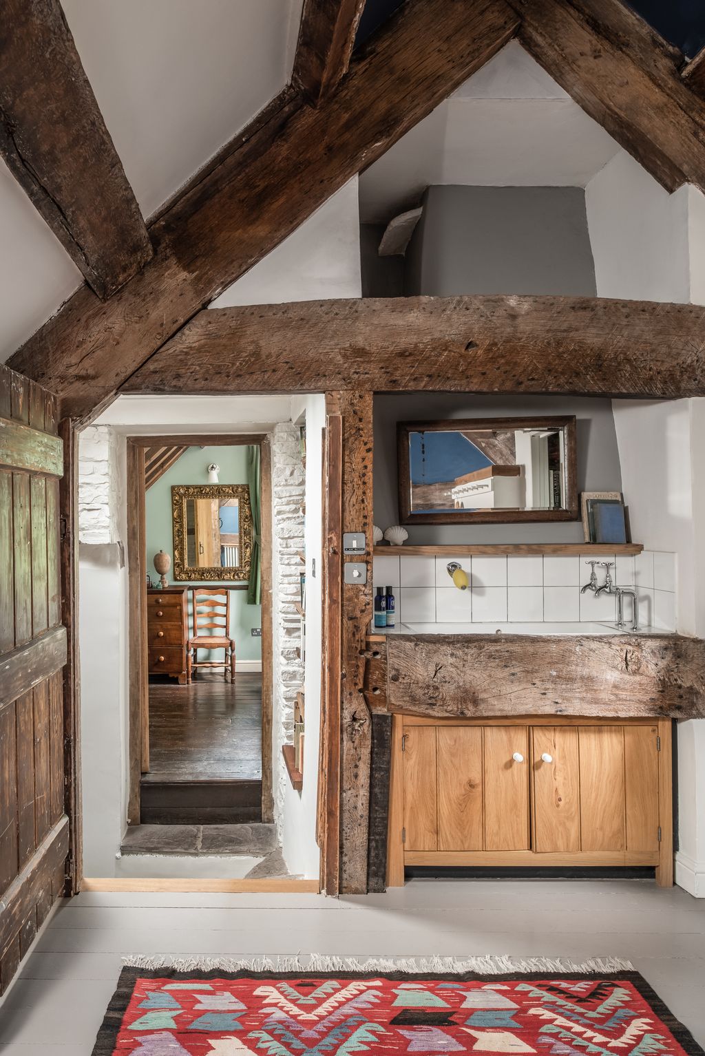 Image may contain Indoors Interior Design Chair Furniture Wood Home Decor Rug Hardwood and Stained Wood