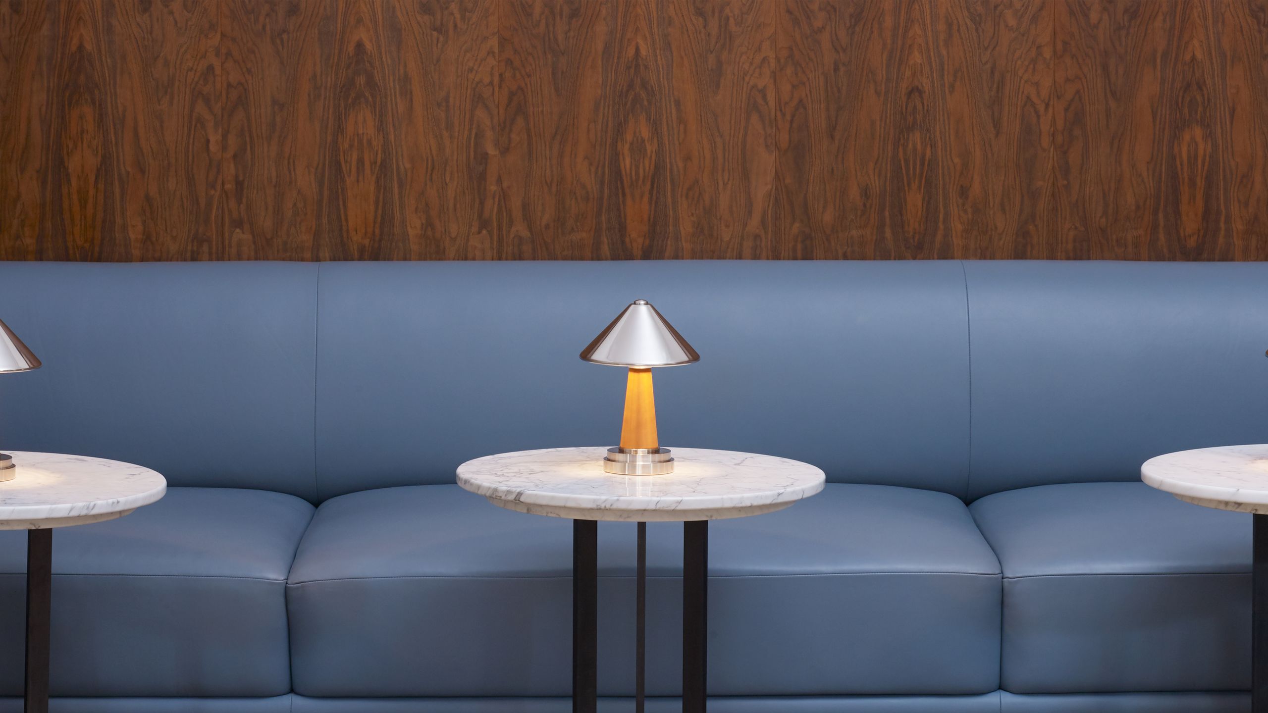 Image may contain: Couch, Furniture, Lamp, Indoors, Interior Design, Desk, Table, Table Lamp, Architecture, and Building