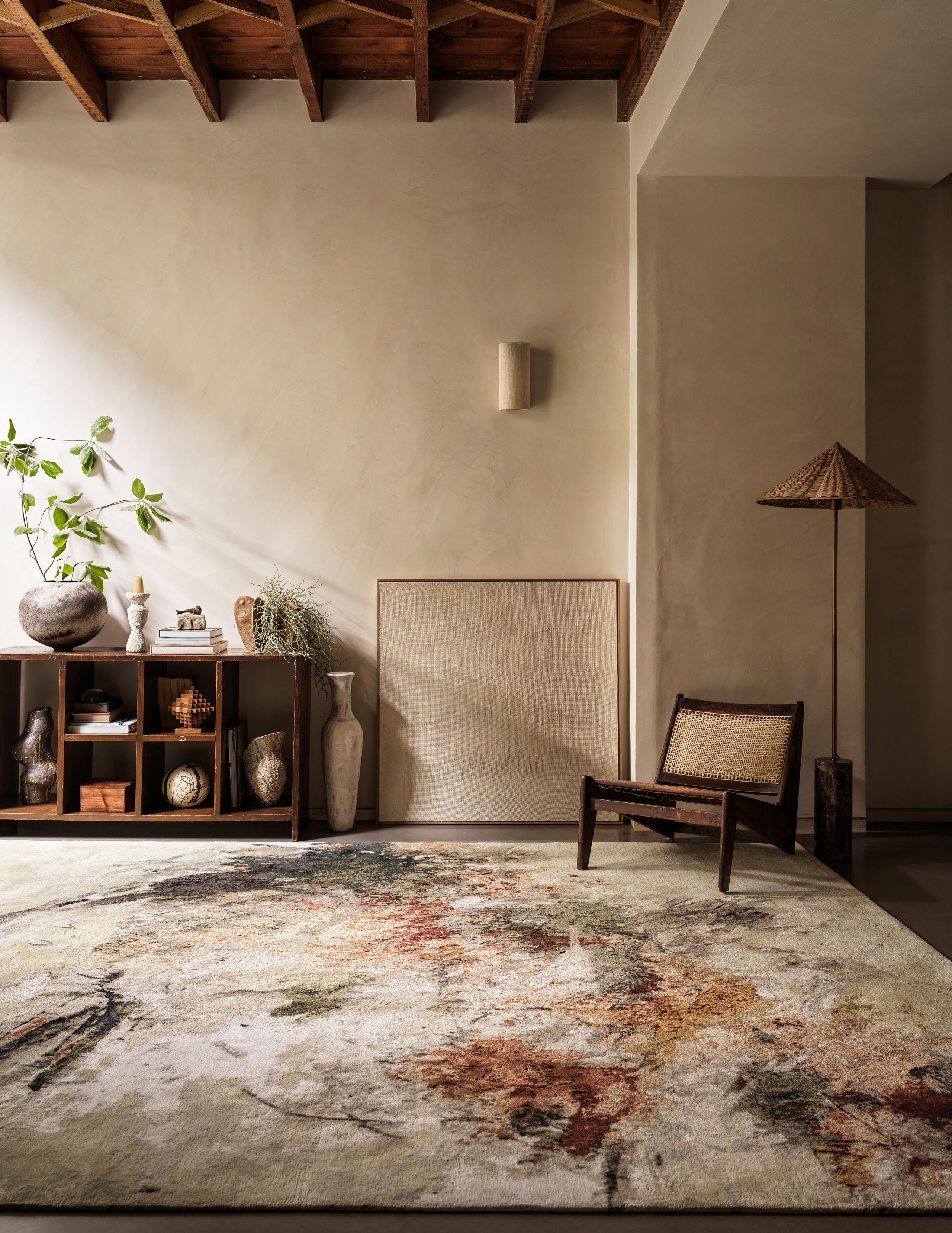 Image may contain: Home Decor, Rug, Floor, Plant, Indoors, Interior Design, Lamp, Chair, Furniture, Flooring, and Plate