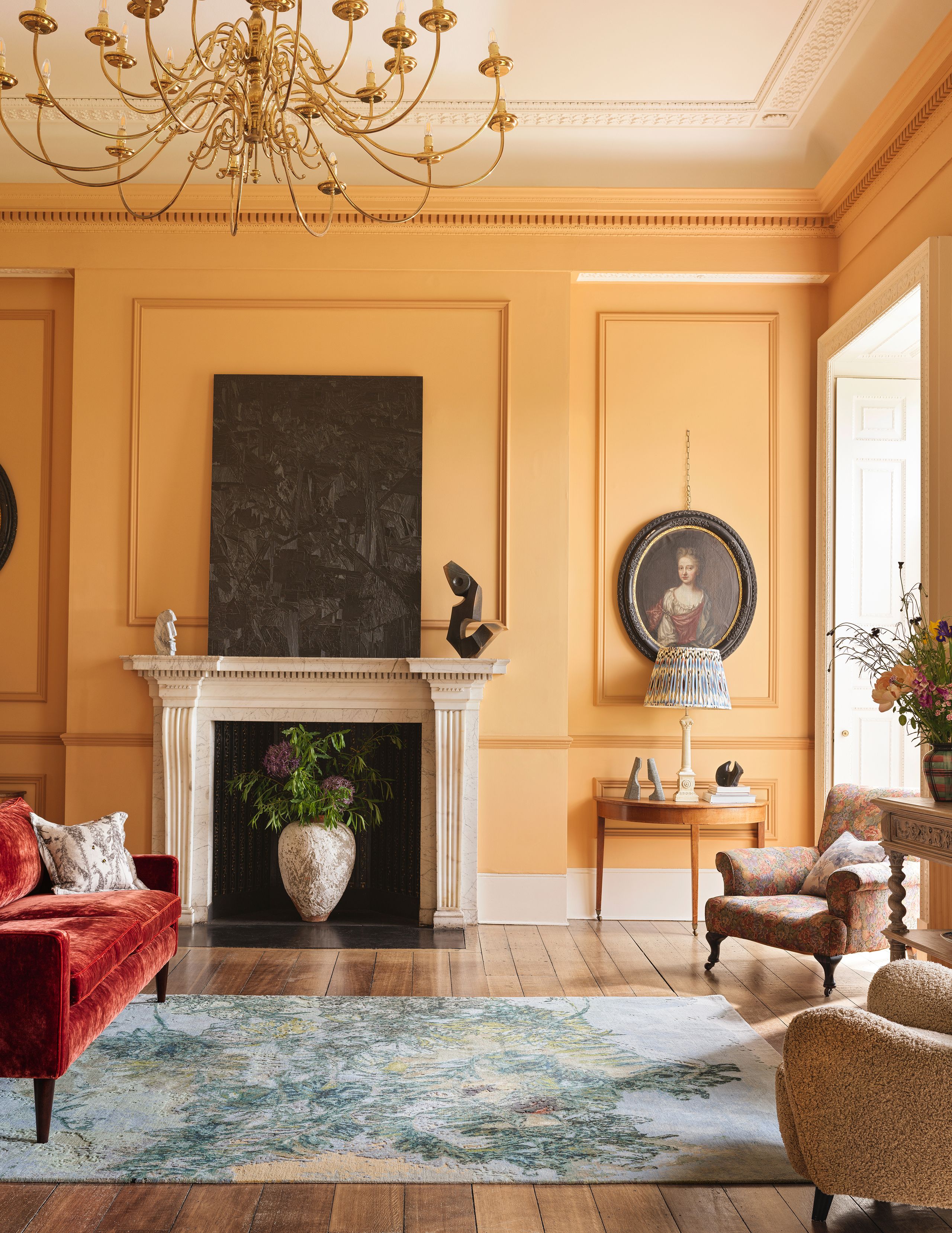 Image may contain: Archduchess Marie Caroline of Austria, Home Decor, Rug, Lamp, Indoors, Interior Design, Person, and Chair