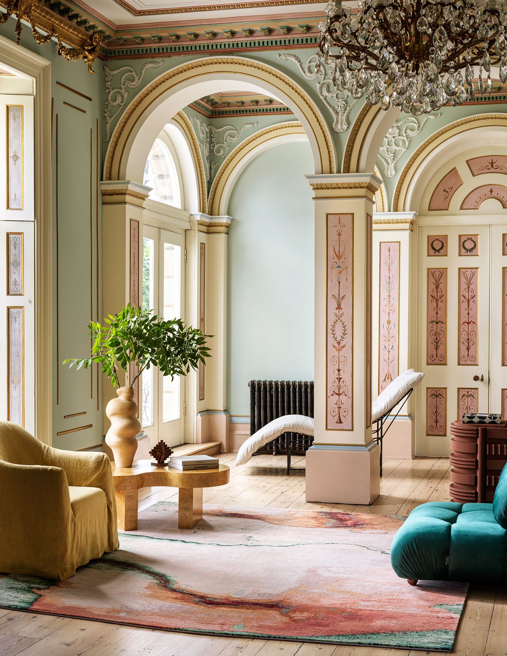 Image may contain: Plant, Home Decor, Rug, Architecture, Building, Foyer, Indoors, Furniture, Living Room, Room, and Lamp