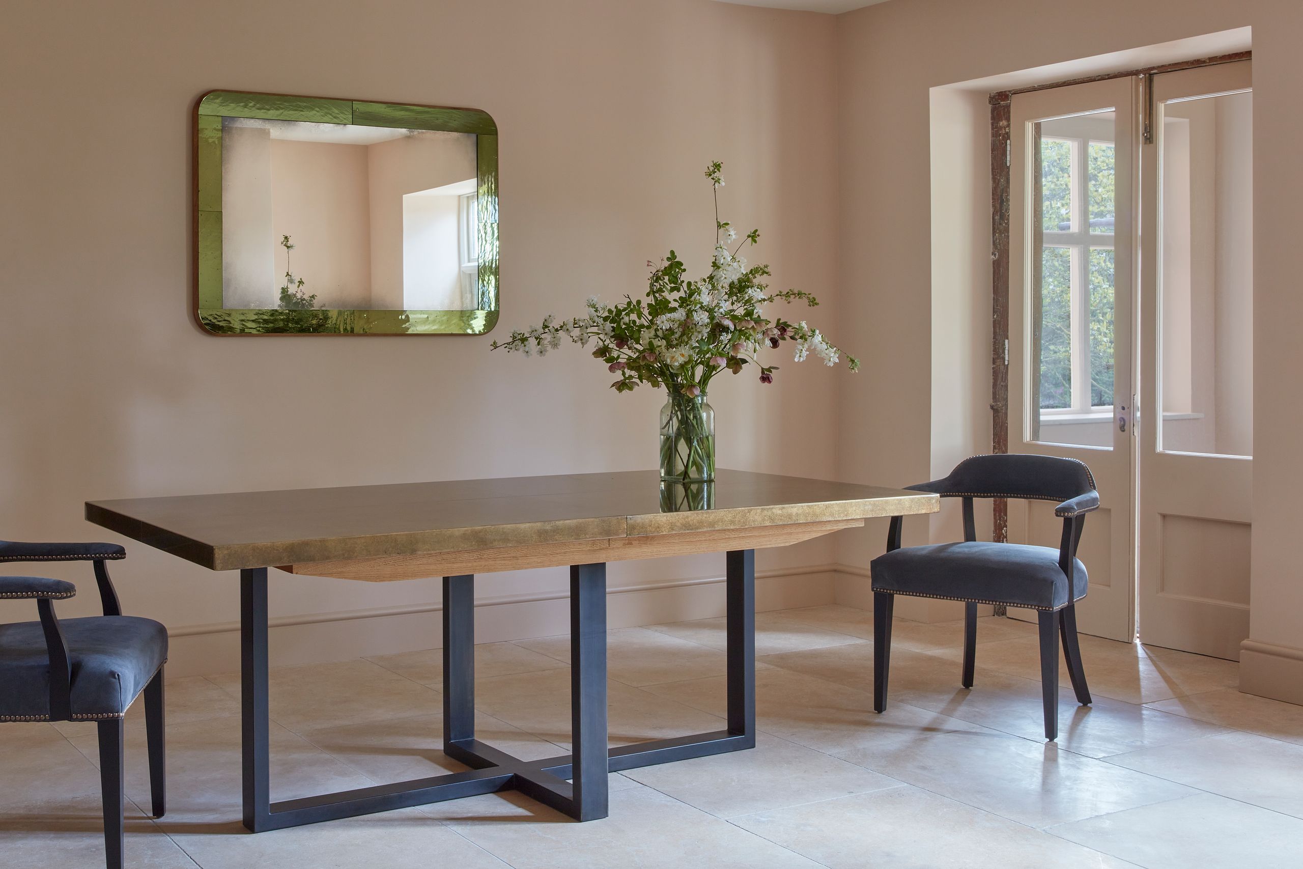 Image may contain: Dining Table, Furniture, Table, Architecture, Building, Dining Room, Indoors, Room, Chair, and Desk