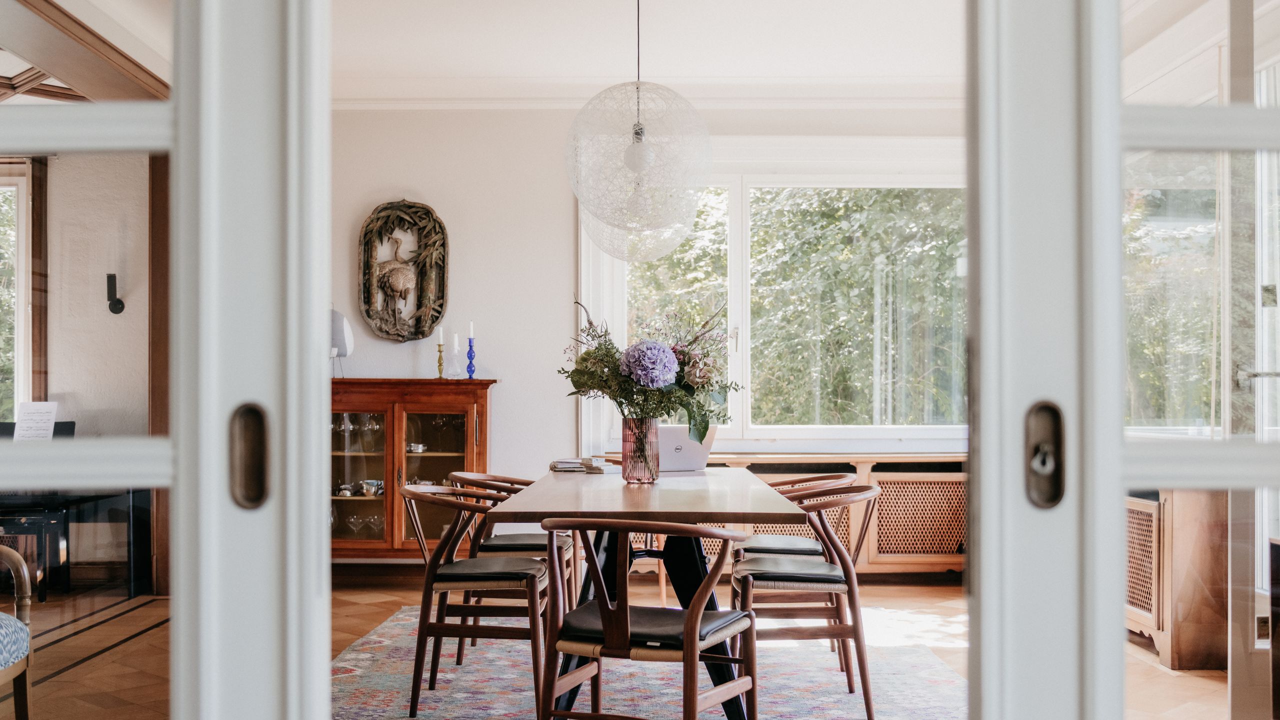 Image may contain: Architecture, Building, Dining Room, Dining Table, Furniture, Indoors, Room, Table, and Door