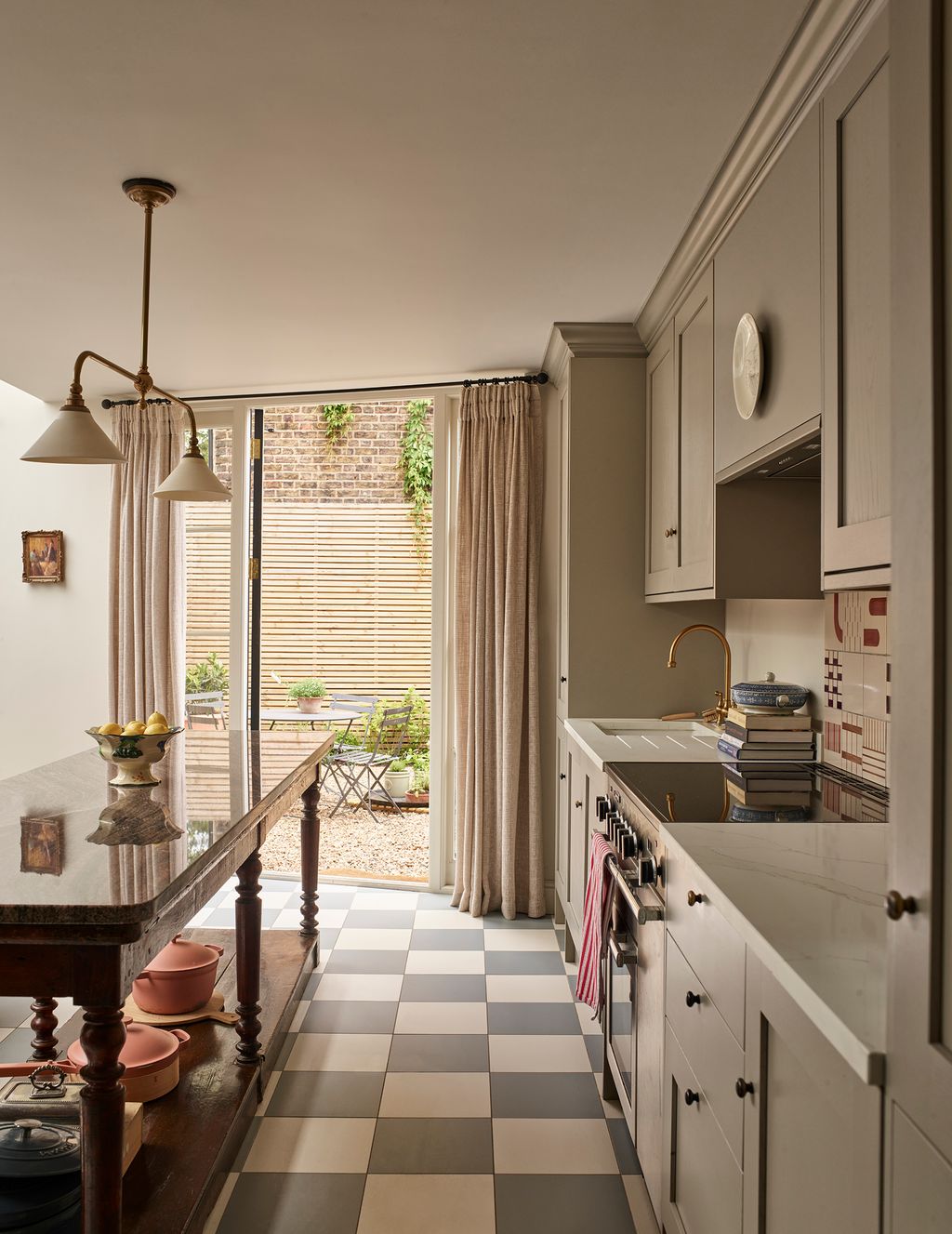 Image may contain Plant Indoors Interior Design Lamp Sink Sink Faucet Art Painting Chair Furniture and Kitchen