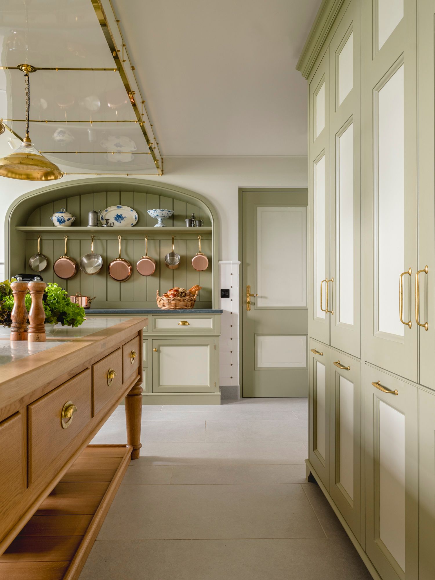 Image may contain: Indoors, Interior Design, Kitchen, Plate, Furniture, Lamp, and Sideboard