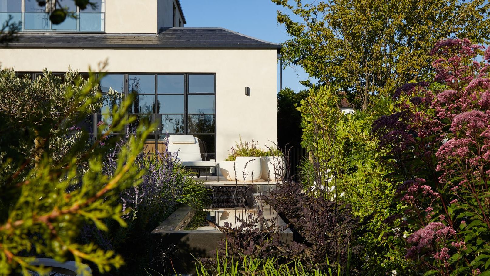 Image may contain: Garden, Nature, Outdoors, Backyard, Yard, Architecture, Building, Cottage, House, Housing, and Indoors