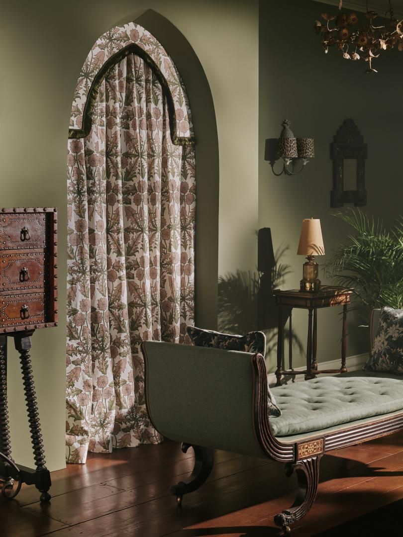 Image may contain: Lamp, Furniture, Desk, Table, Indoors, Plant, and Chair