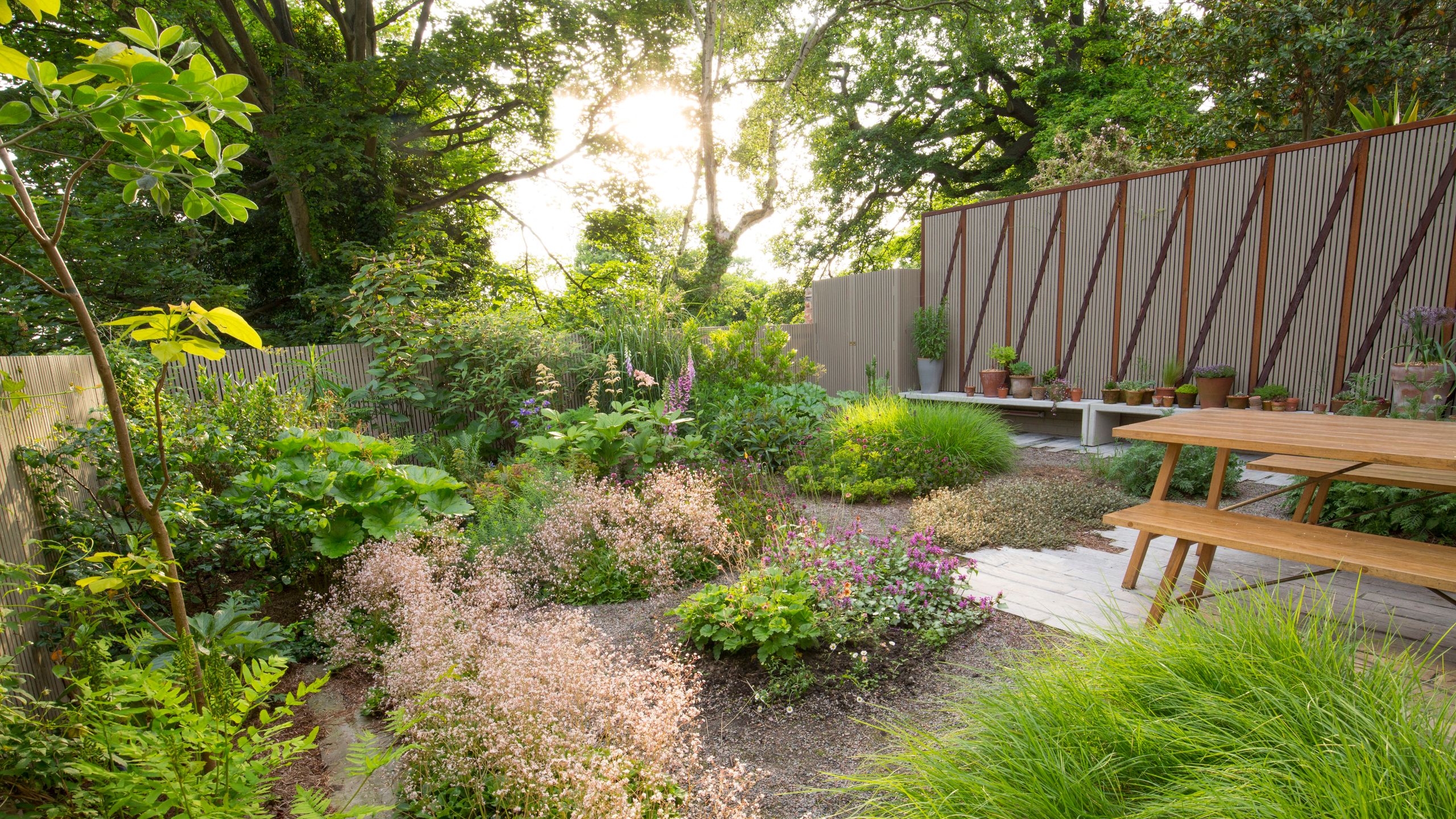 Image may contain: Backyard, Nature, Outdoors, Yard, Garden, Grass, Plant, Vegetation, Desk, Furniture, Table, and Bench