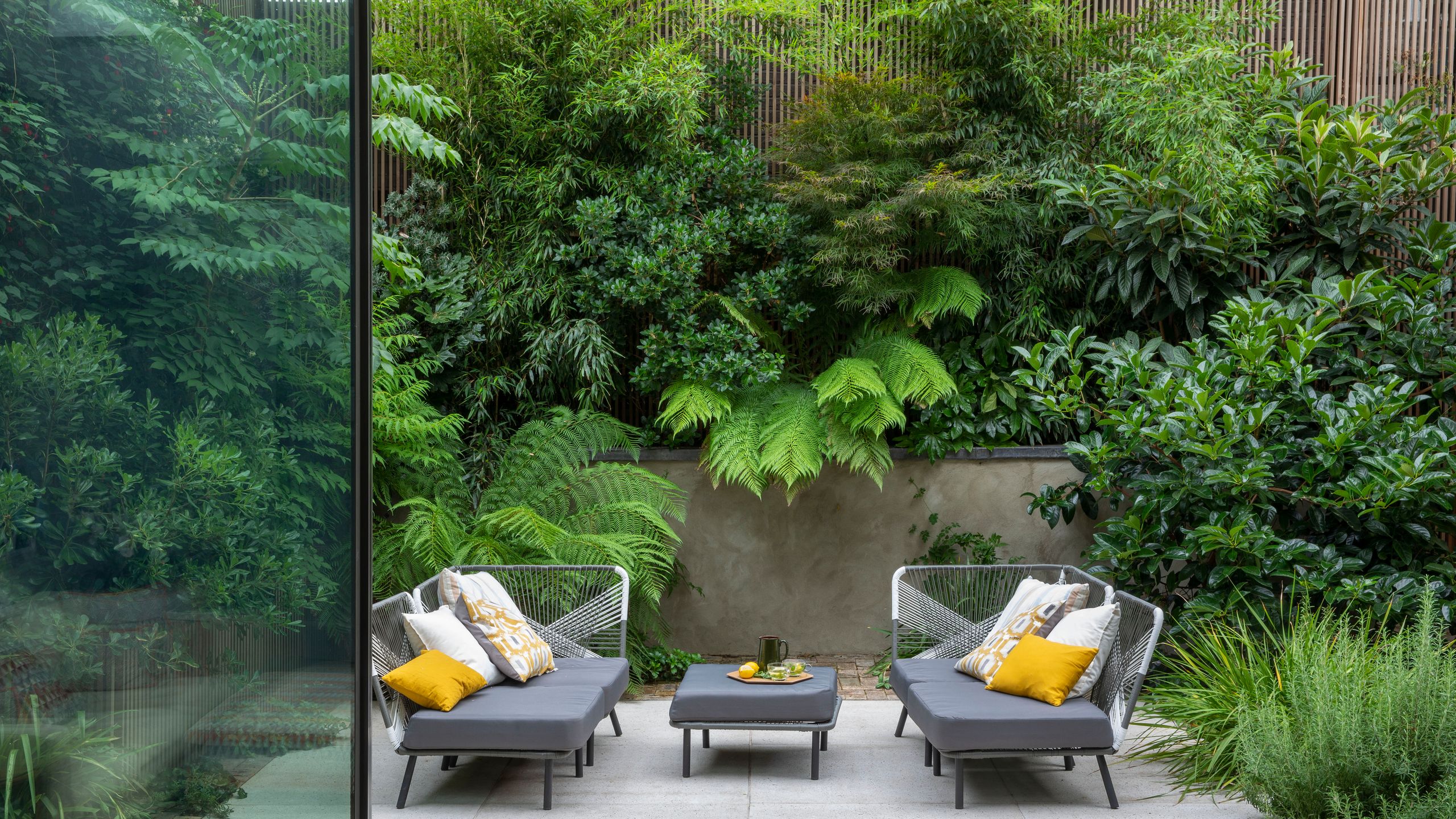 Image may contain: Backyard, Nature, Outdoors, Yard, Garden, Architecture, Balcony, Building, Bench, Furniture, and Plate