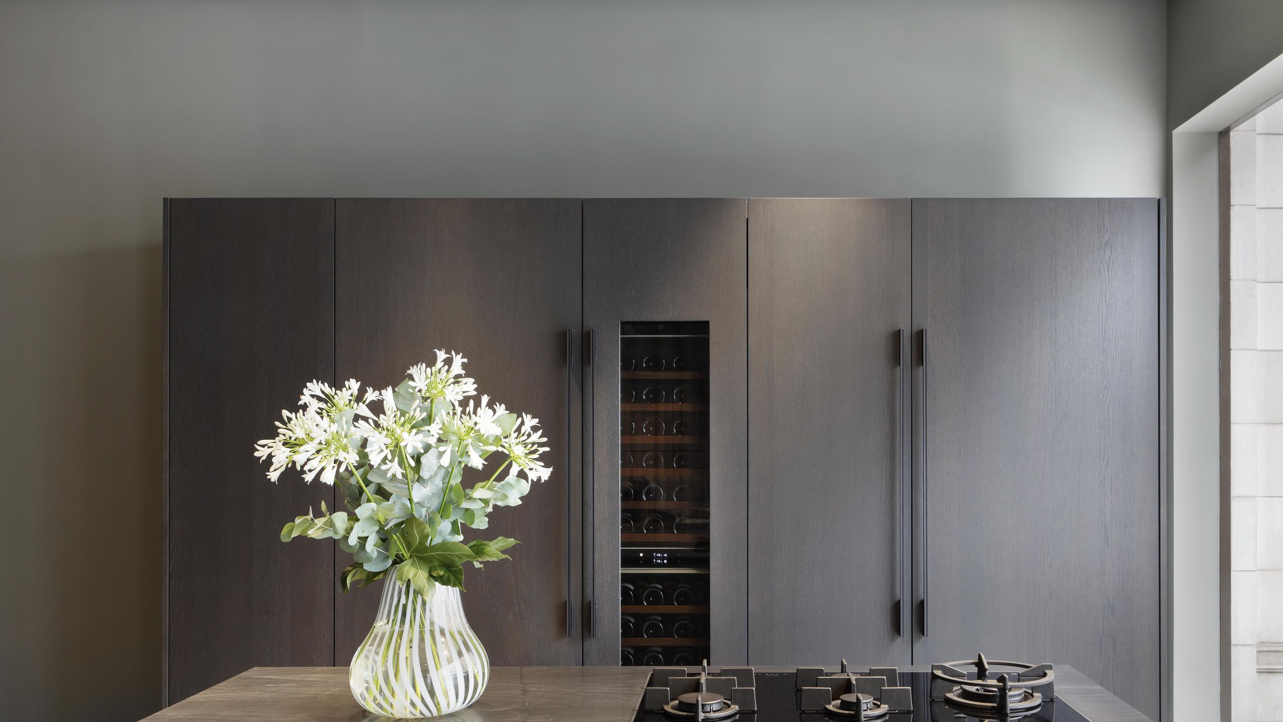 Image may contain: Indoors, Interior Design, Flower, Flower Arrangement, Plant, Furniture, and Kitchen