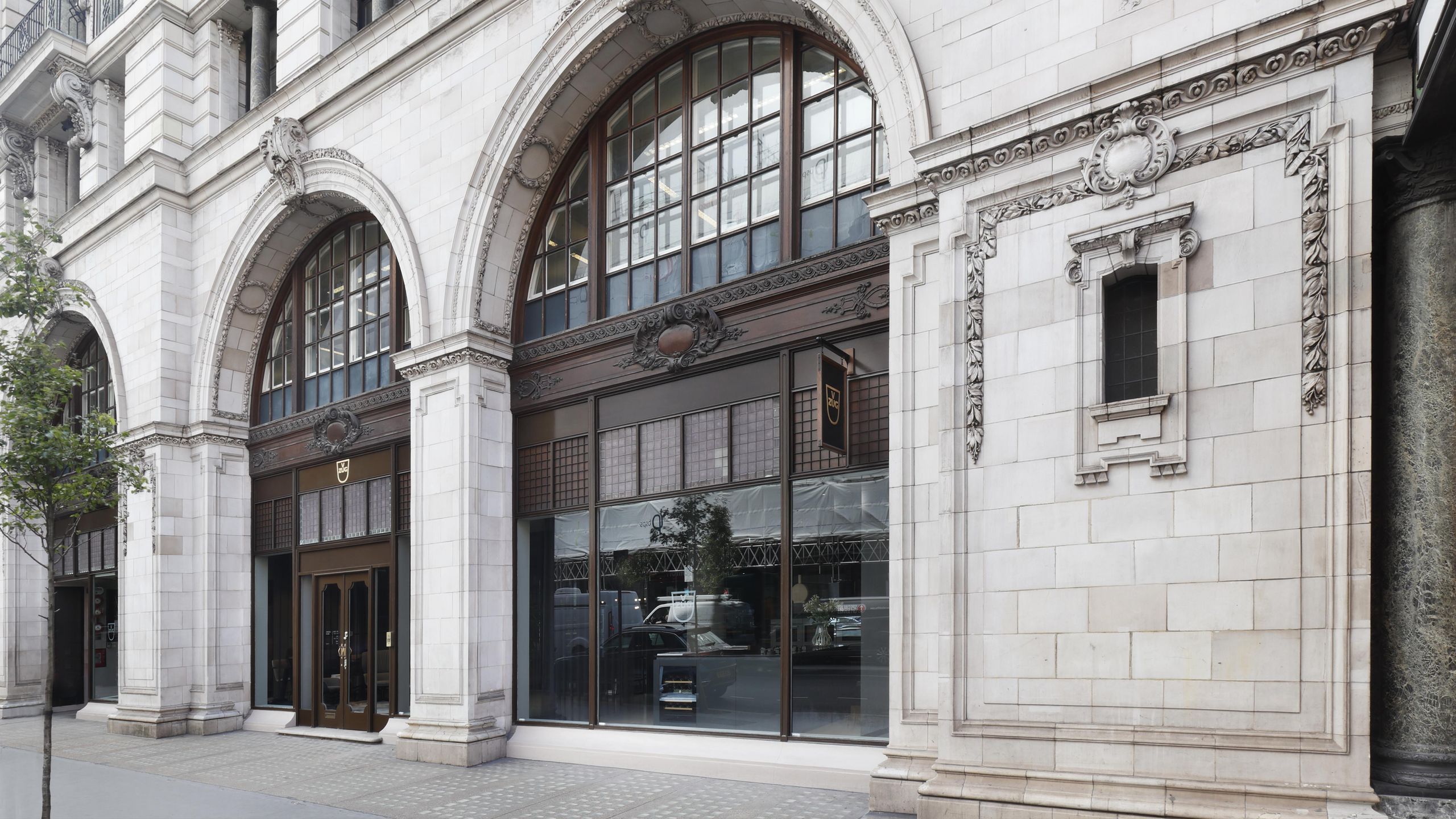 Image may contain: Arch, Architecture, City, Urban, Gothic Arch, Building, Office Building, Car, Transportation, and Vehicle