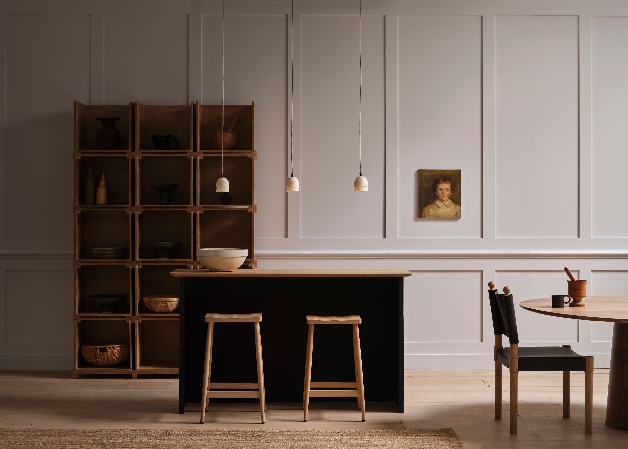 Image may contain: Indoors, Interior Design, Furniture, Person, Chair, Wood, Cup, Table, Desk, and Wood Panels