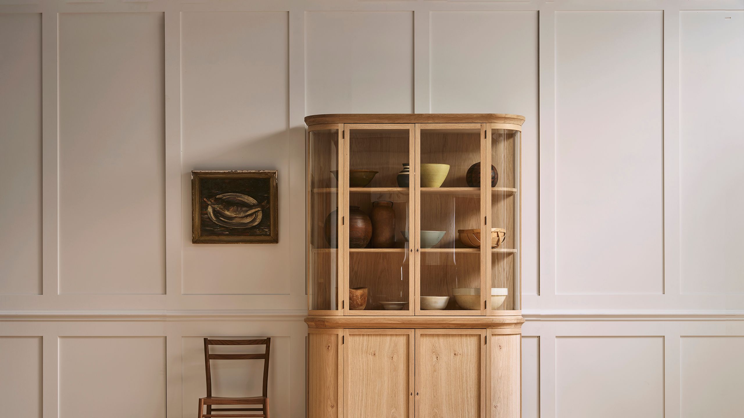 Image may contain: Indoors, Interior Design, Closet, Cupboard, Furniture, Cabinet, Wood, Sideboard, Hardwood, and Art