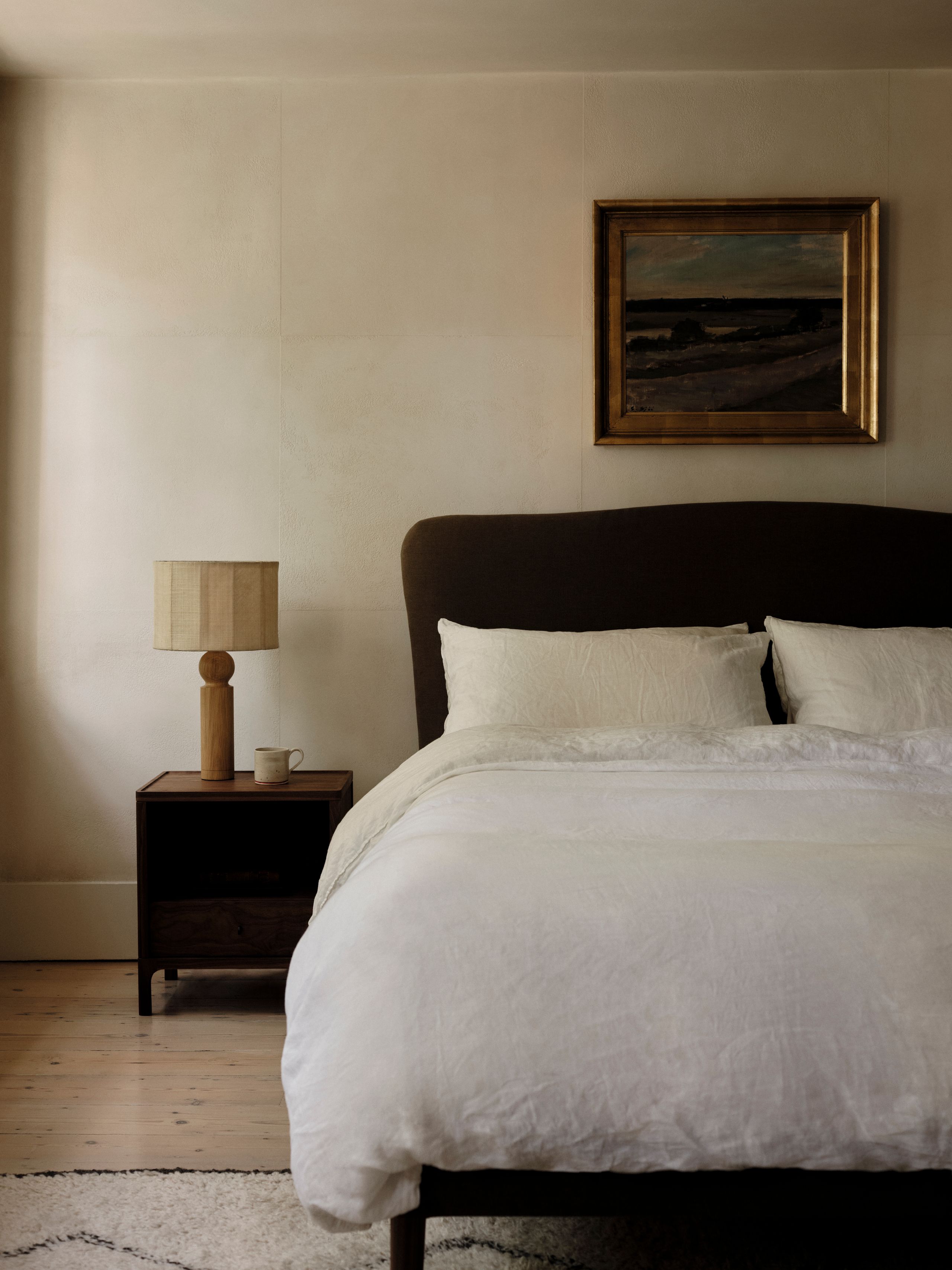 Image may contain: Lamp, Cup, Table Lamp, Indoors, Interior Design, Bed, Furniture, Art, Painting, Cushion, and Home Decor