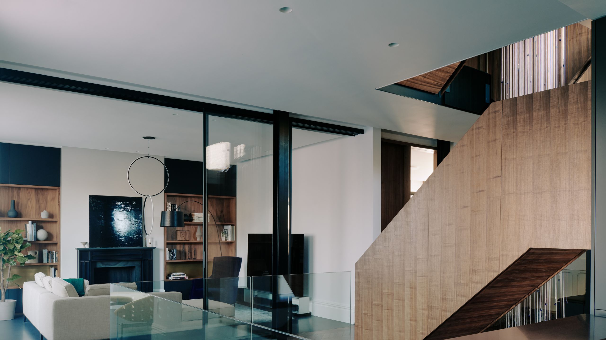 Image may contain: Indoors, Interior Design, Architecture, Building, Furniture, Living Room, Room, Plant, and Table