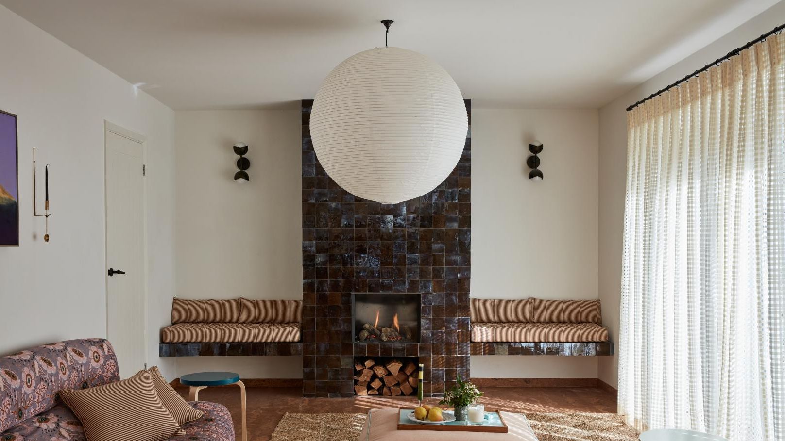 Image may contain: Home Decor, Lamp, Couch, Furniture, Fireplace, Indoors, Architecture, Building, Living Room, and Room