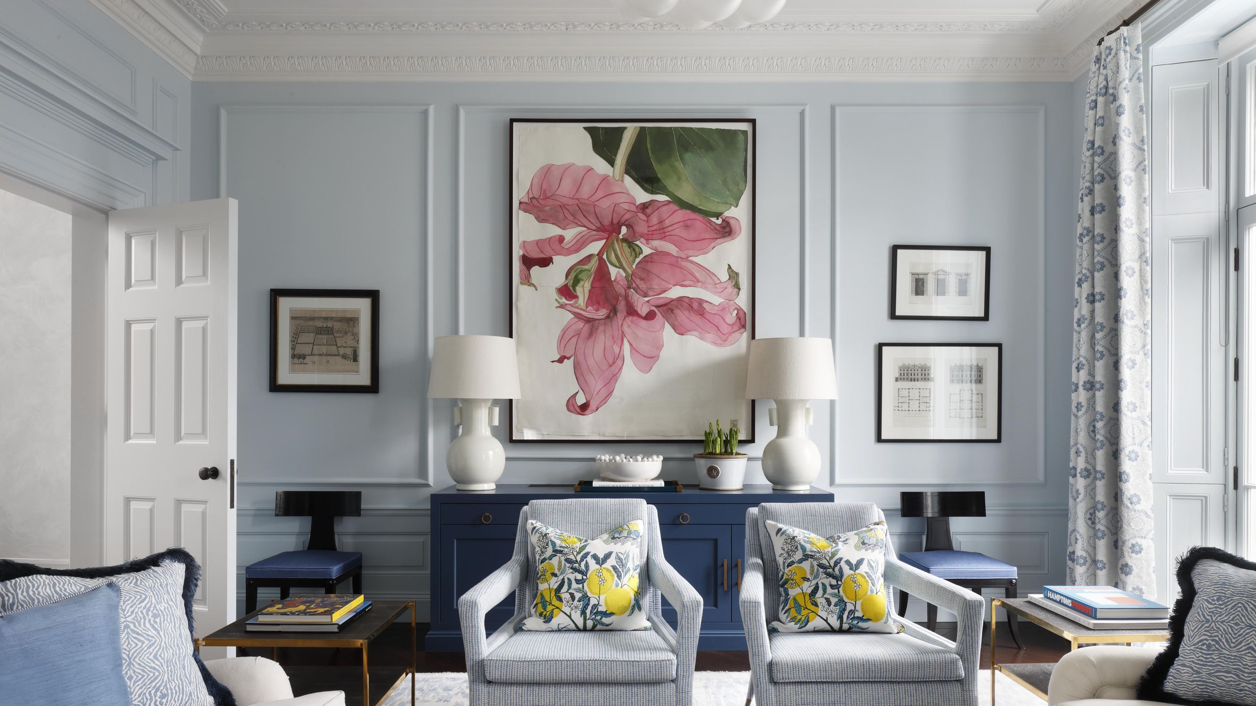 Image may contain: Home Decor, Architecture, Building, Furniture, Indoors, Living Room, Room, Lamp, Chair, Cushion, and Couch