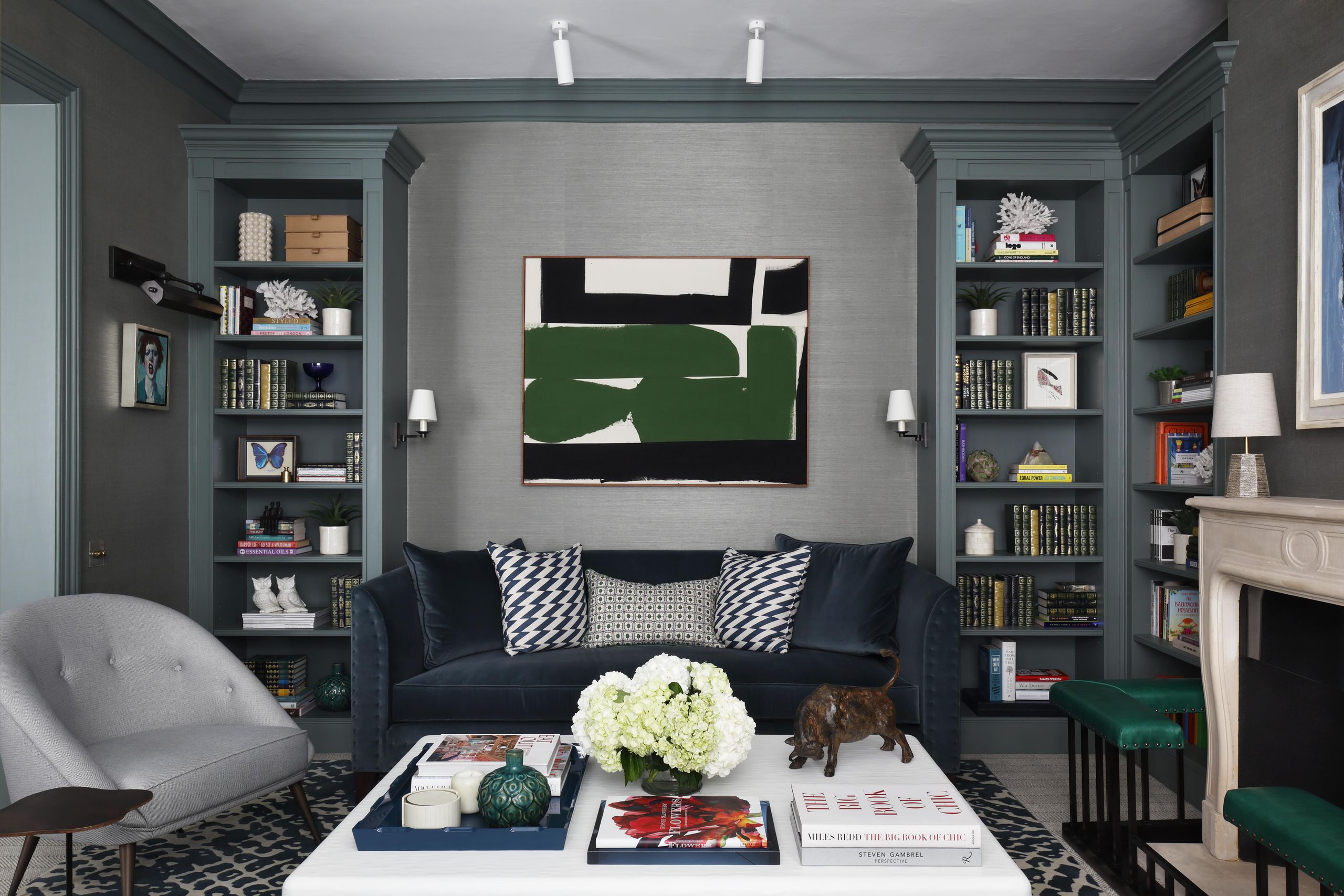 Image may contain: Book, Publication, Architecture, Building, Furniture, Indoors, Living Room, Room, Home Decor, and Lamp