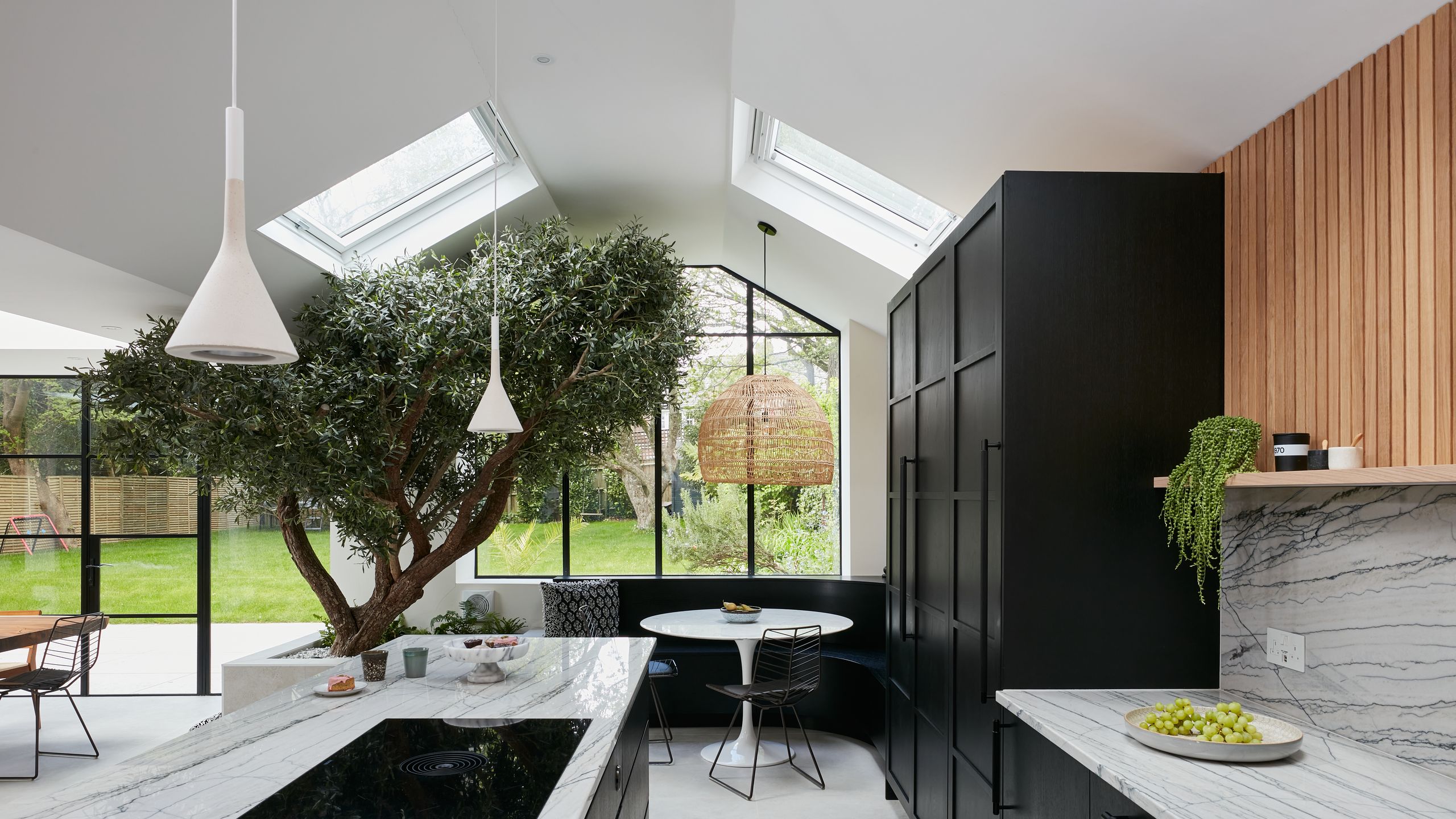 Image may contain: Indoors, Interior Design, Cup, Lamp, Chair, Furniture, Window, Kitchen, Sink, Floor, Desk, and Table