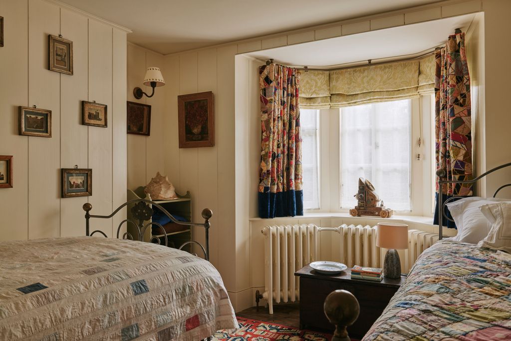 Image may contain Lamp Bed Furniture Art Painting Home Decor Plate Window Indoors Interior Design and Book