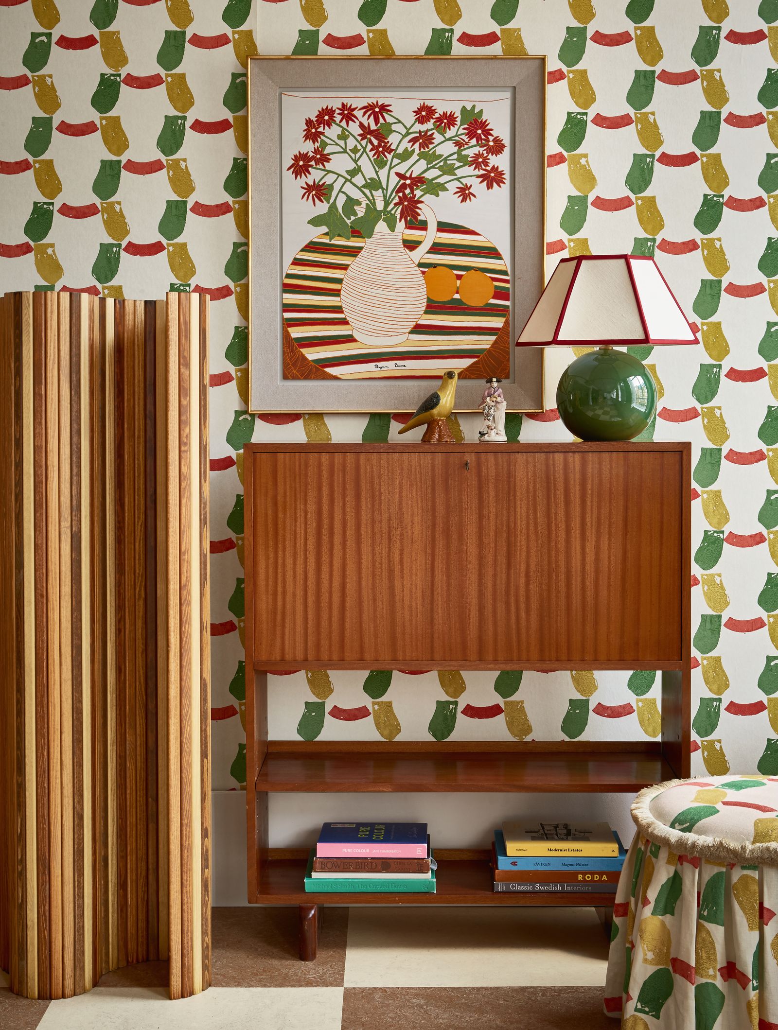 Image may contain Indoors Interior Design Lamp Table Lamp Person Furniture Book Publication Animal Bird and Art