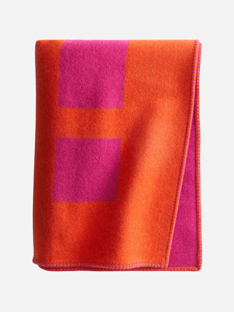 Image may contain: Clothing, Fleece, Blanket, and Flag